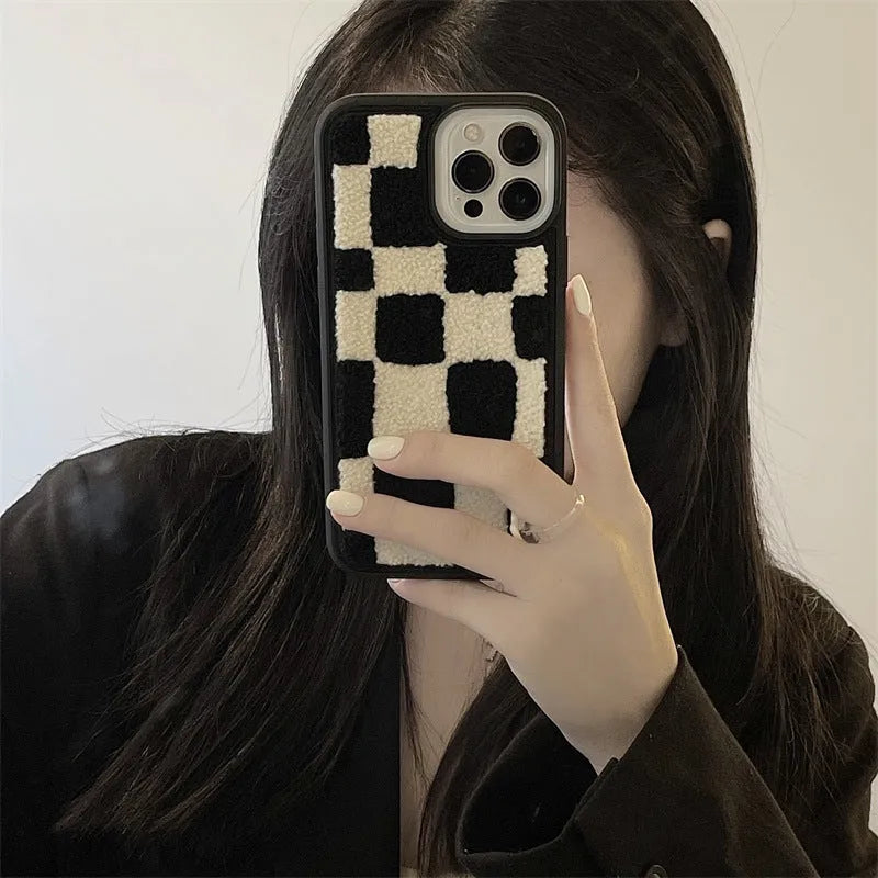 Black and white lattice silicone back cover for Apple iPhone, protective case on a white background