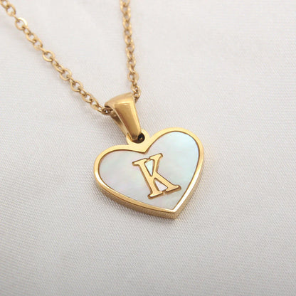 A personalized heart-shaped necklace with a 26-letter charm, crafted from high-quality stainless steel and gold plating.