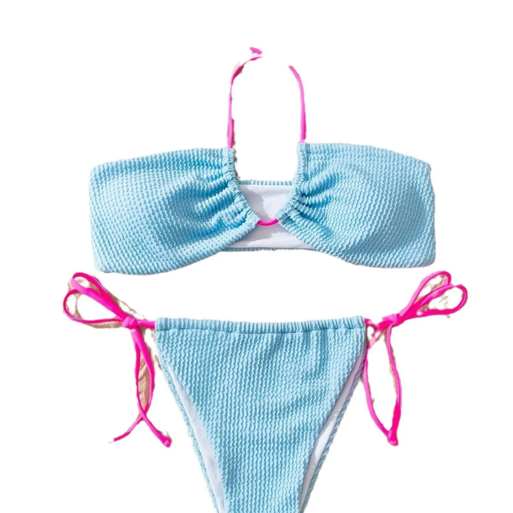 Solid colour women's two-piece swimsuit with halter neck and lace-up back detail