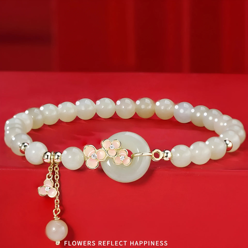 Peach blossom Hetian jade bracelet and necklace set with floral beads in sterling silver mounting