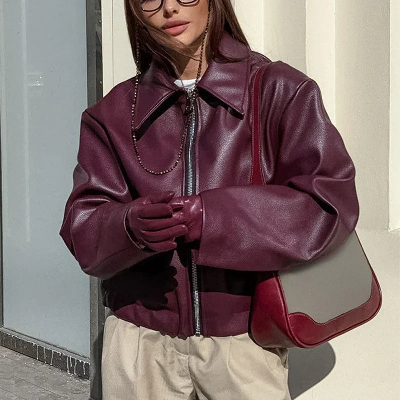 Premium faux leather jacket with zipper closure and lapel collar design, available in burgundy and black colors