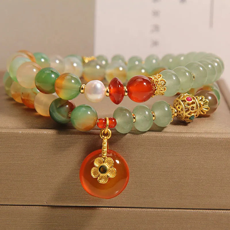 Peacock green agate double ring bracelet for women with safety buckle clasp and rhinestone details.
