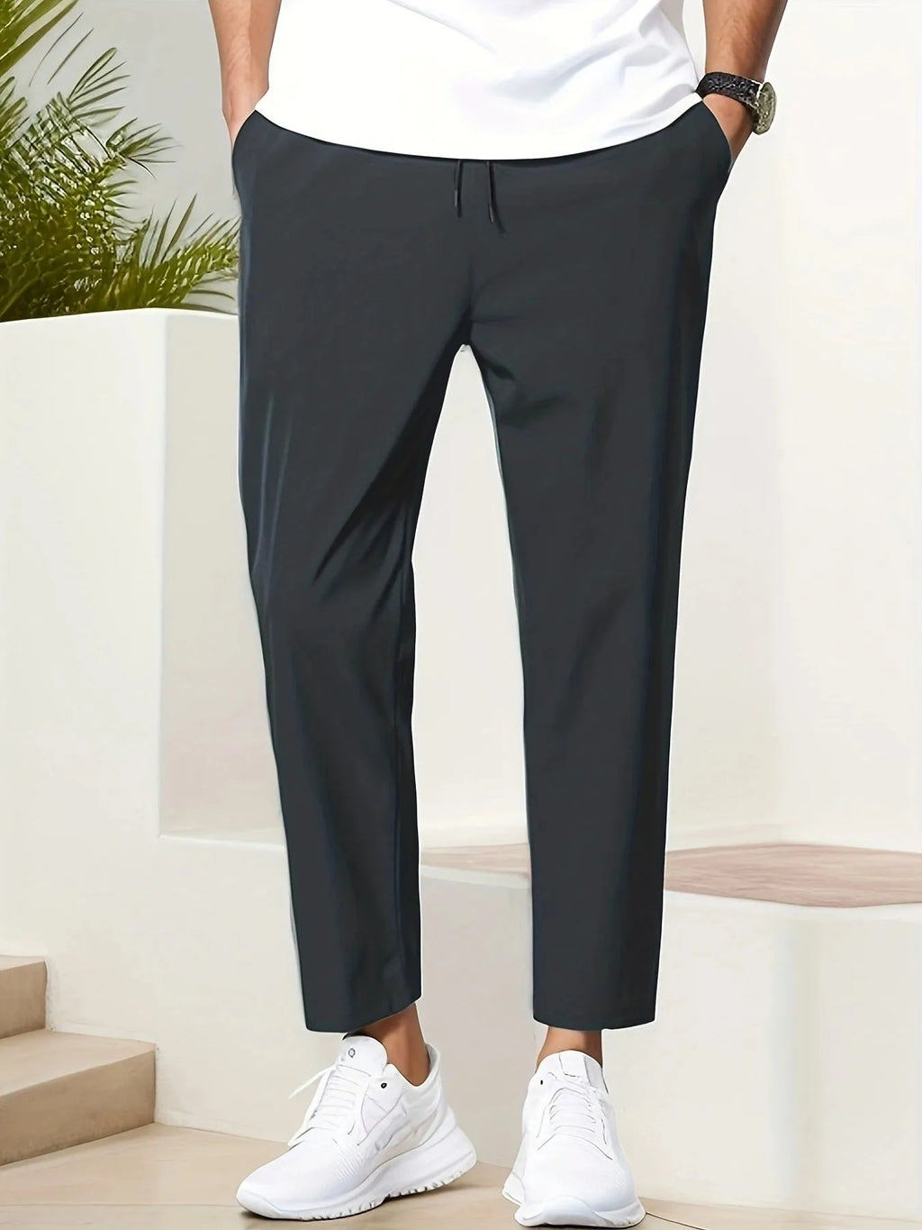 Men's slim fit ankle length trousers in black polyester, tapered leg, mid waist, cropped cut.