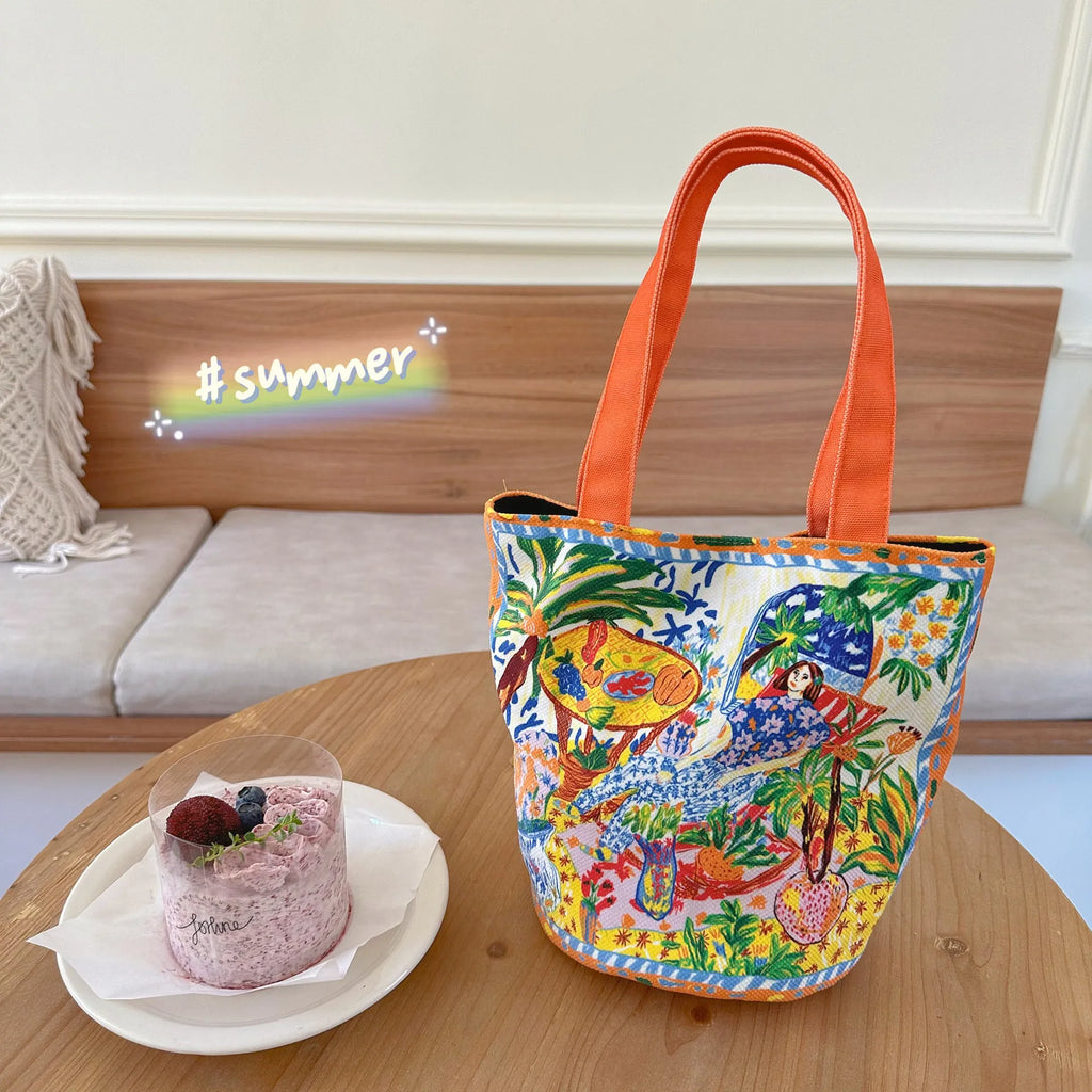 Dream Garden orange plush canvas Thailand artistic bucket bag with double straps and printed details.