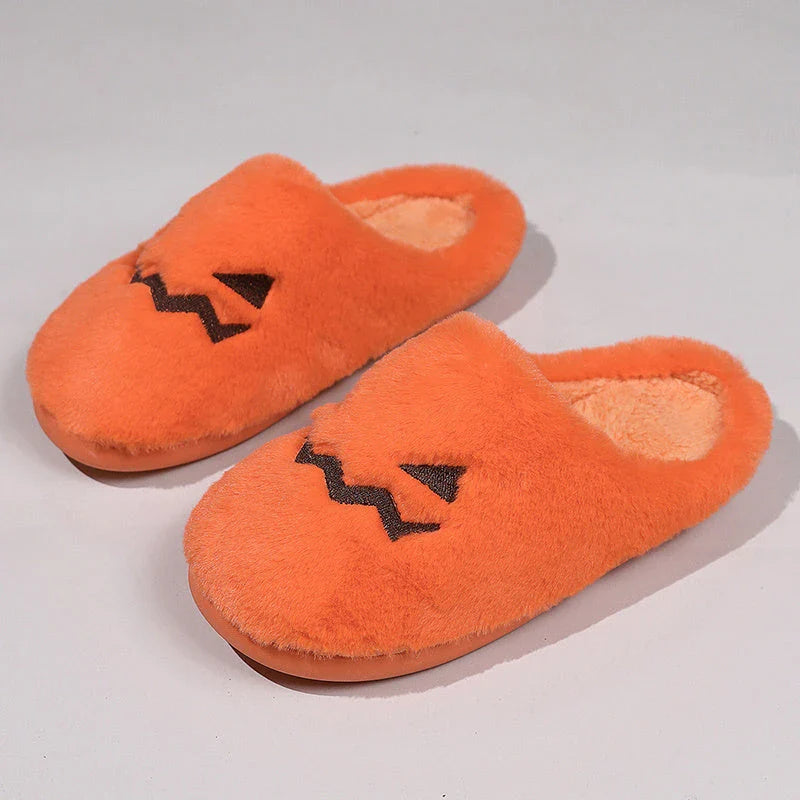 Cozy pumpkin-themed slippers with plush coral velvet upper and non-slip PVC sole for comfortable indoor wear