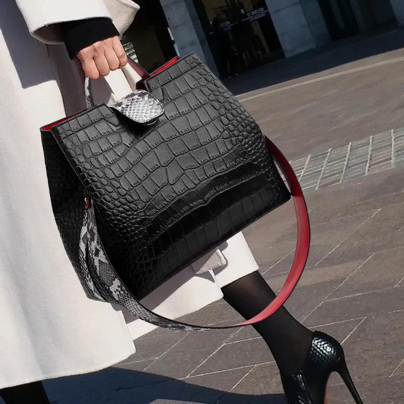 Black women's messenger bag bucket shape with colour contrast detailing and zipper closure