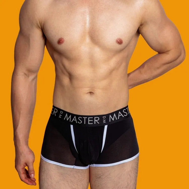 Men's low waist ice silk shorts in solid colours like army green and black, laid flat.