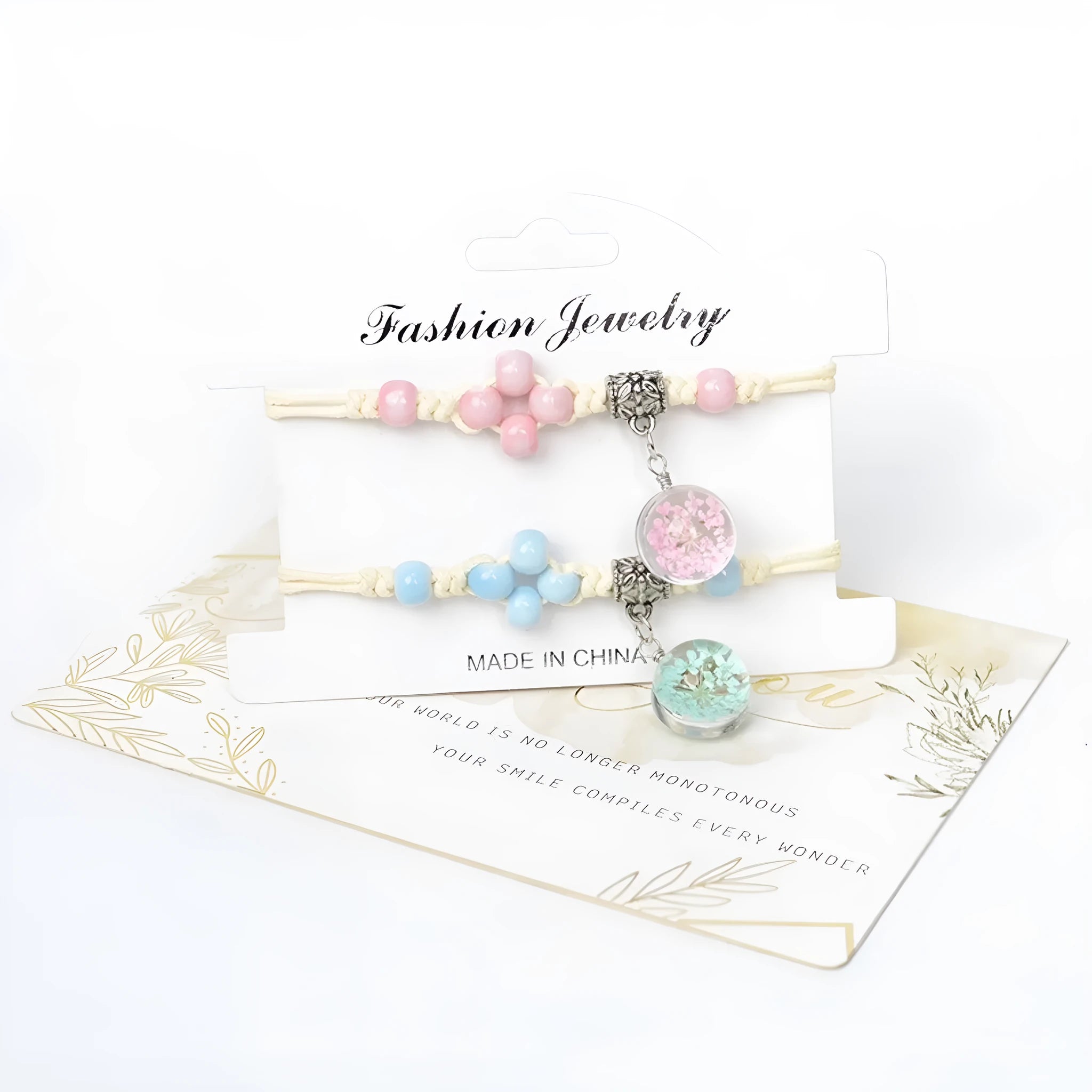 Close-up of a hand-woven glass bracelet with large 1.4cm beads containing real dried flowers in various colours.