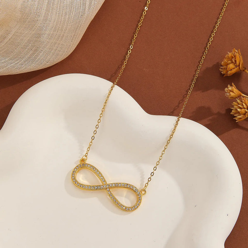Gold plated copper infinity symbol pendant necklace with sparkling diamond inlay and gold fine chain