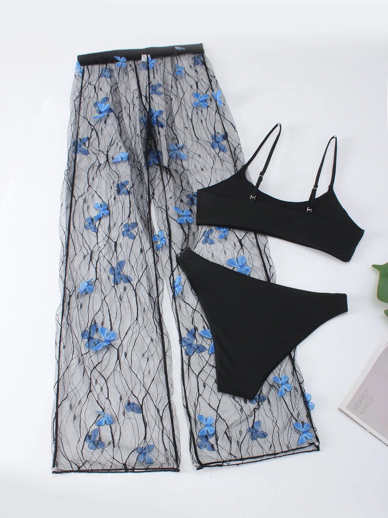 Women's black transparent butterfly pattern bikini three-piece set, showing top, underwear, and pants.