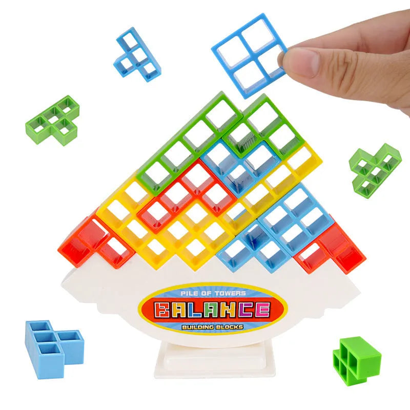 Plastic balance stacking game with coloured building blocks, chassis, and base on a table
