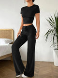 Black high waist trousers and matching short sleeve t-shirt set on hanger