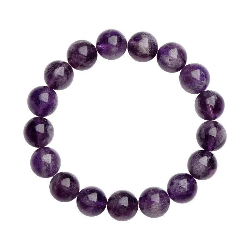 Natural Feather Amethyst purple crystal bracelet with scattered geometric beads on a wrist.