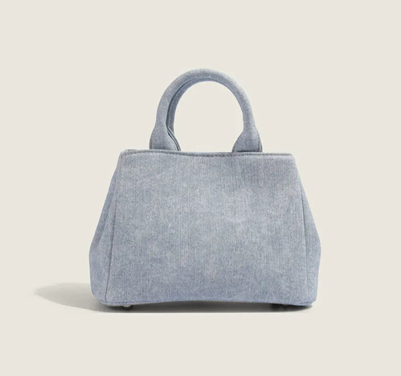 Women's casual shoulder bag made from soft PU material in denim blue colour with standard size dimensions