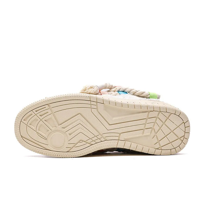Creamy white low-top retro skateboard shoes with lace-up front and platform sole.