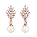 Geometric flower earrings with micro inlaid zircon and pearl details in gold, platinum, or rose gold finishes