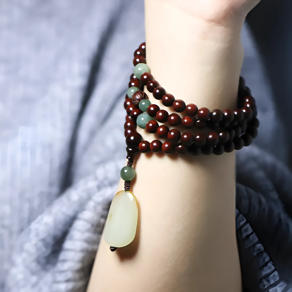 Carved rosewood bead bracelet with a Hotian Jade pendant, showing 6mm and 8mm size options.