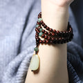 Carved rosewood bead bracelet with a Hotian Jade pendant, showing 6mm and 8mm size options.
