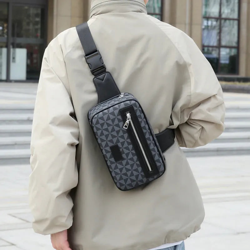 Men's black crossbody shoulder bag with printed chest design and sewing line detailing
