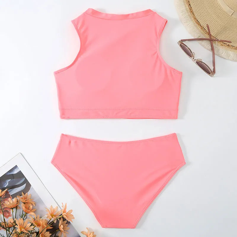 Pink high waist bikini swimsuit set with split design on a solid colour background.