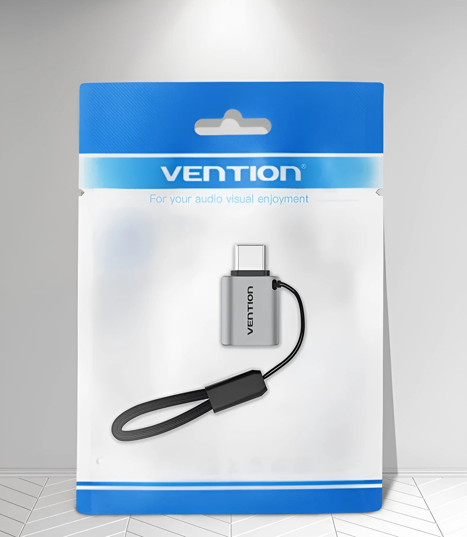Grey aluminium USB 3.0 C Male to A Female OTG adapter with attached lanyard.