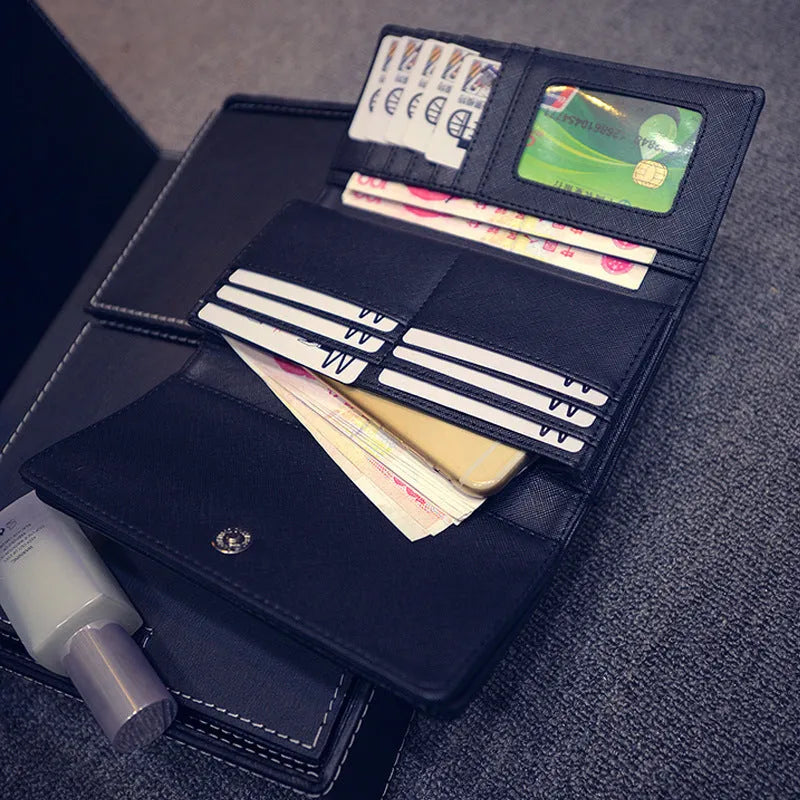 Women's long tri-fold wallet in black PU leather with silver rivet accents on front