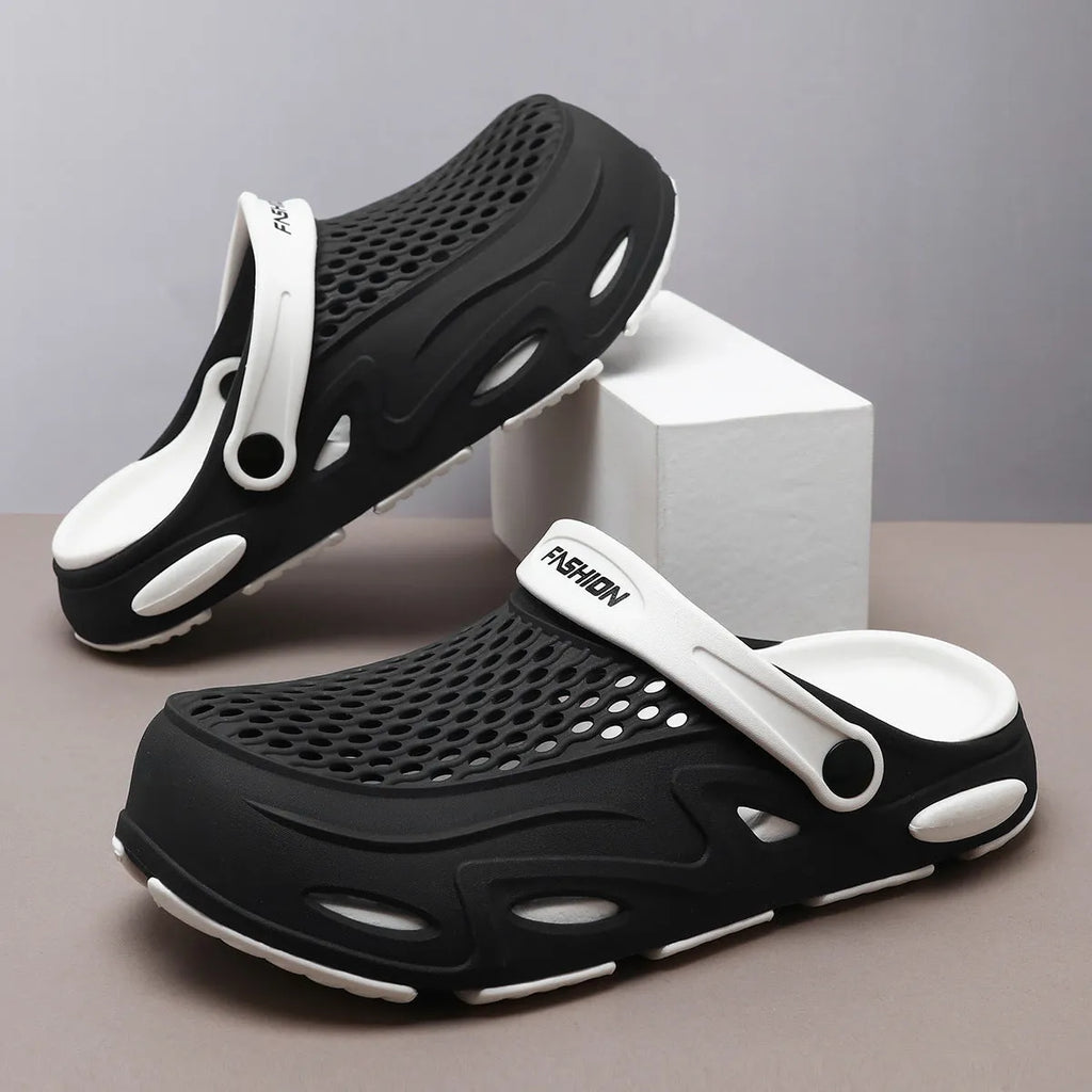 Men's grey closed toe beach slippers with a grid pattern design and a flat sole.