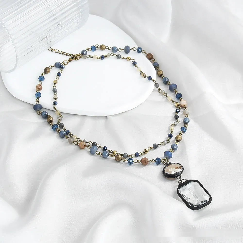 Tribal style necklace with glass stone pendant on two-layer adjustable chain