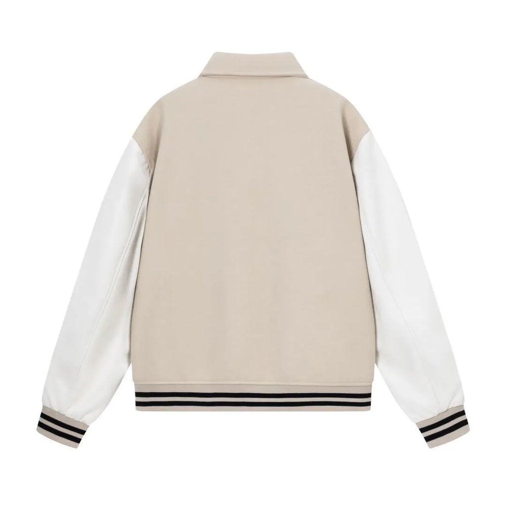 Apricot and brown woolen jacket with embroidered bone pattern detail on front.