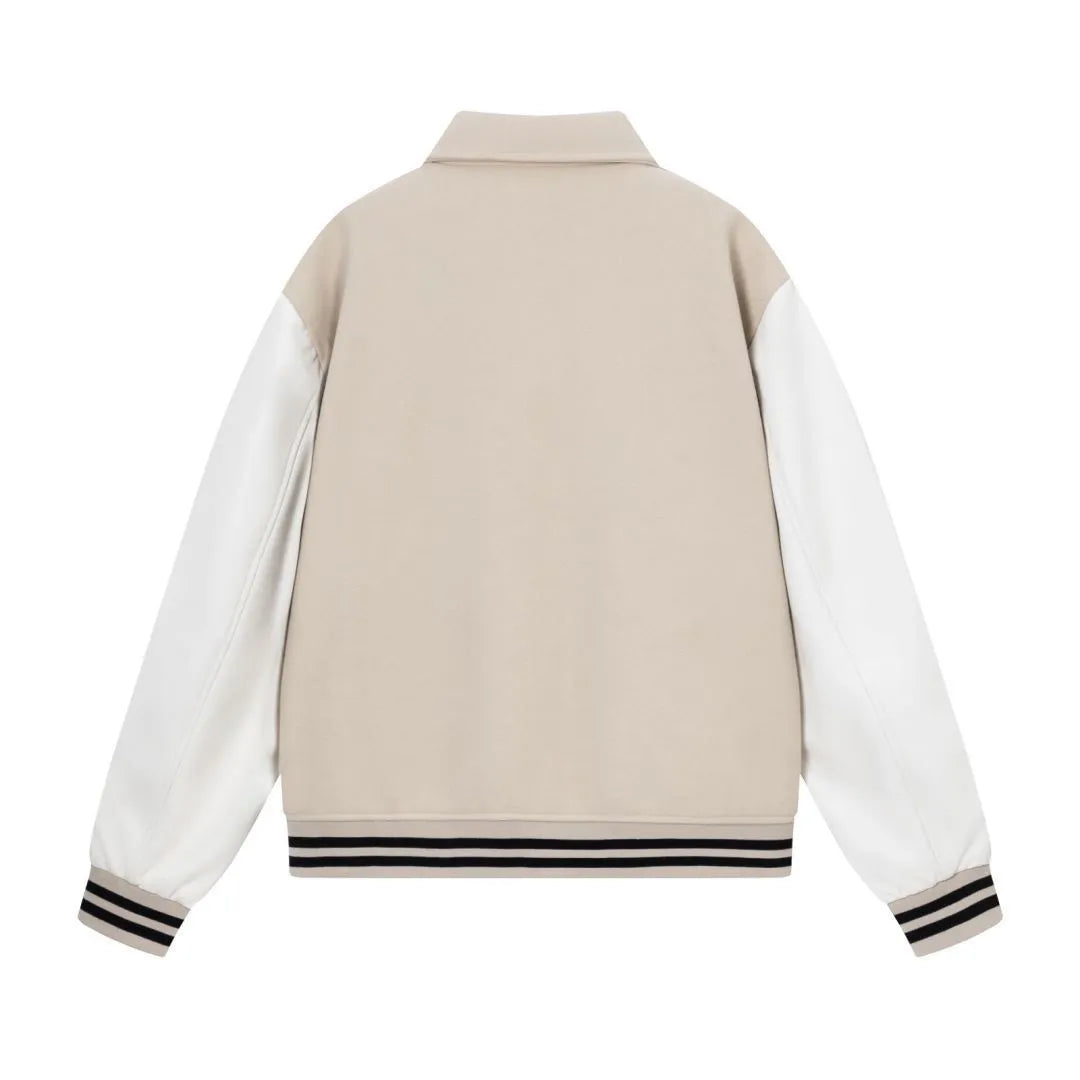 Apricot and brown woolen jacket with embroidered bone pattern detail on front.