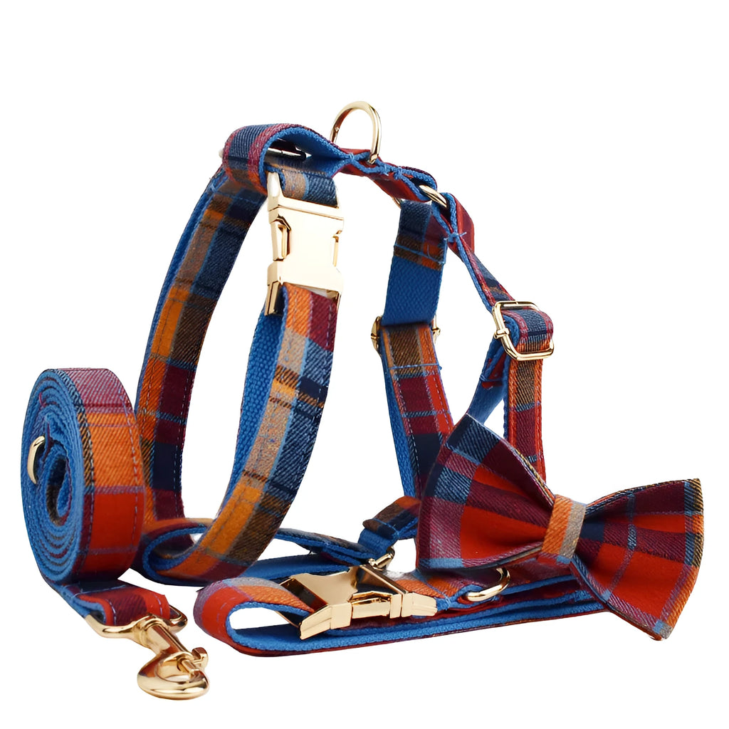 Gentleman-style dog collar, leash, bow, and vest four-piece cloth pet accessory set laid out flat.