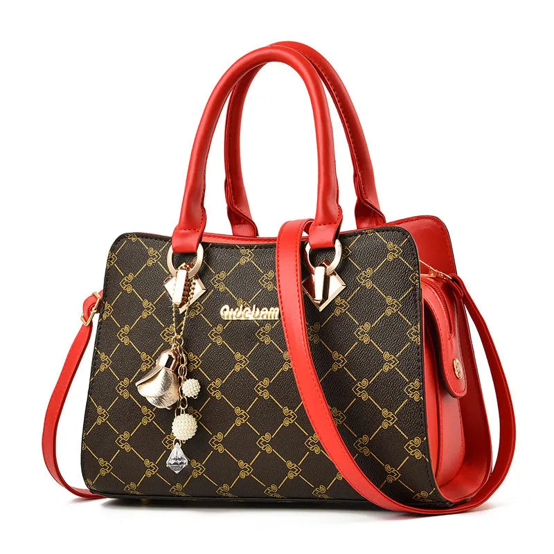 Women's geometric print messenger bag in PU material with stitching detail and zip closure