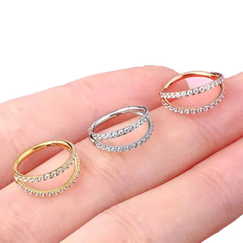 G23 titanium alloy nose ring in gold colour on a white background, showing a circular shape.