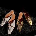 Genuine leather women's square toe slippers in beige, low heel, shown from side.