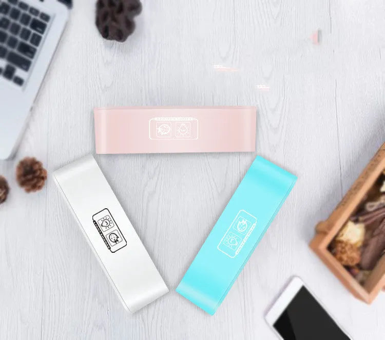 Blue rectangular multifunctional LED atmosphere light alarm clock with digital display on a wooden surface.