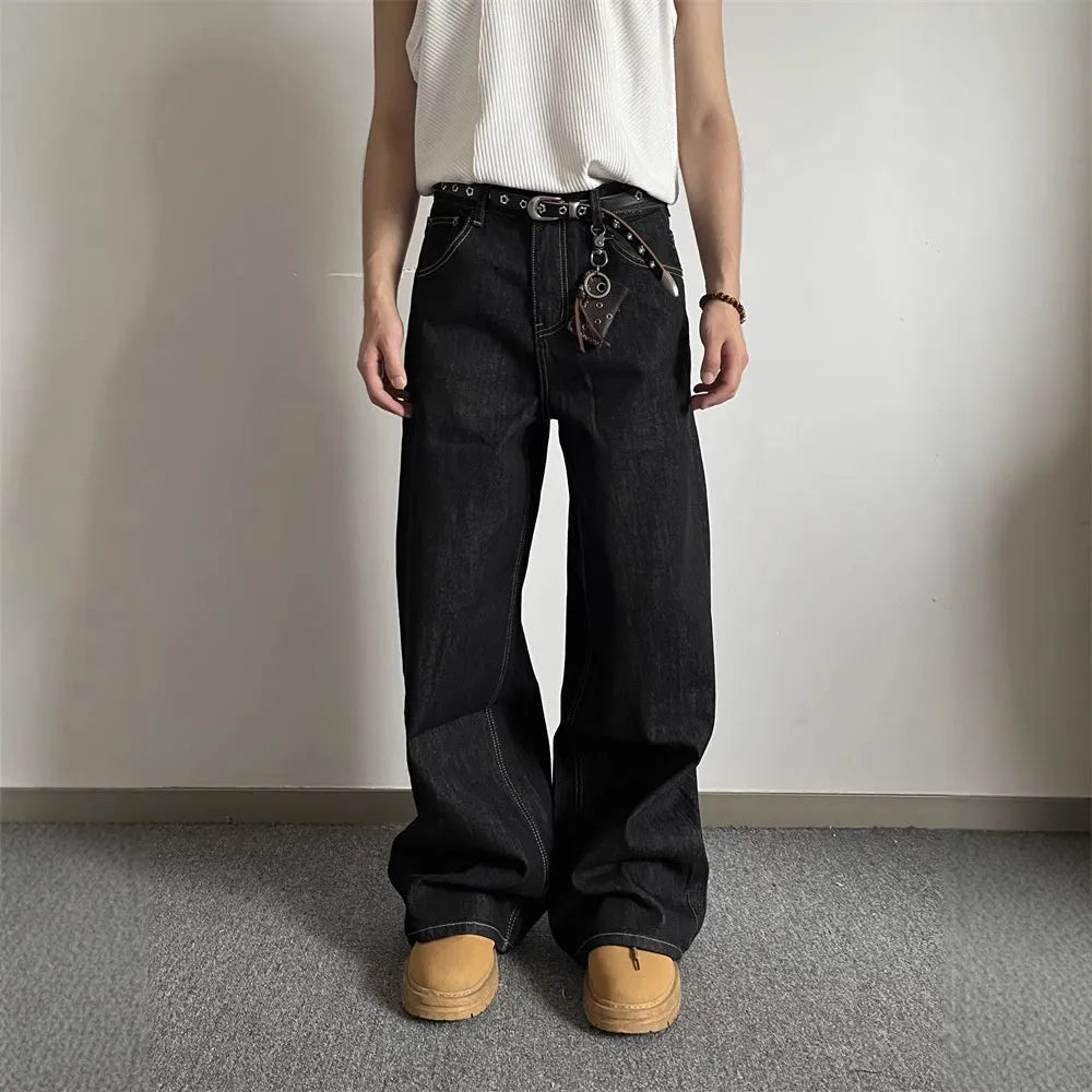 Black retro-style loose-fit straight-leg denim jeans on a hanger.
