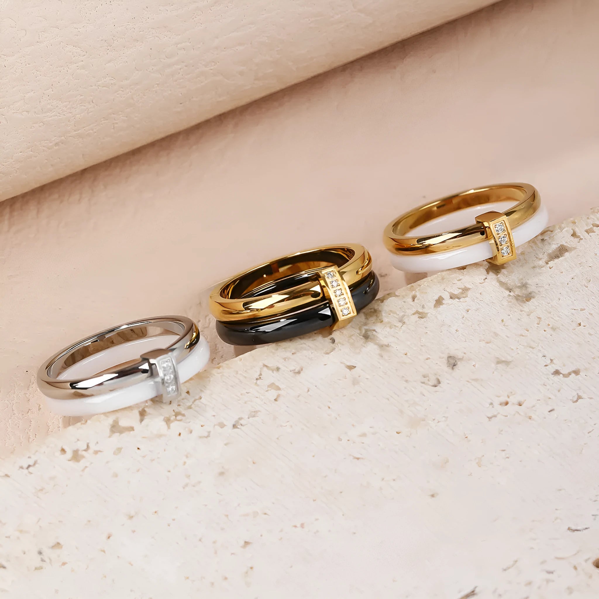 Women's titanium steel heart-shaped double ring with glossy stitching and inlaid zirconium stones in three colour options.
