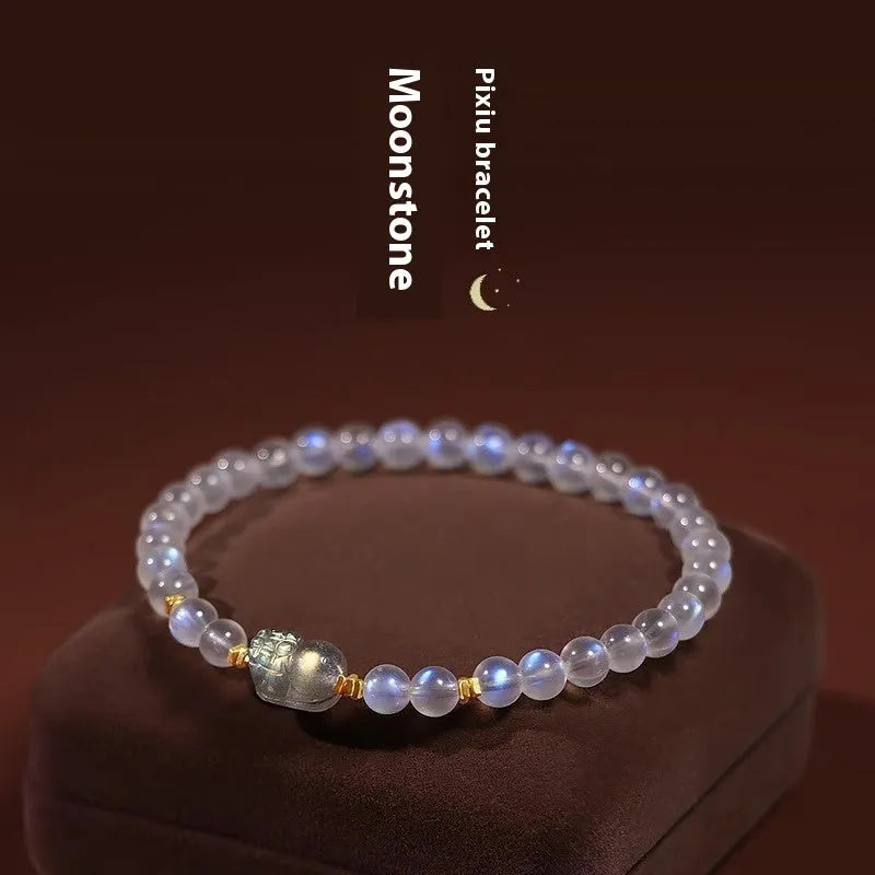 Moonstone women's bracelet with hand-ground beads and animal zodiac charms in fashion blue light colour