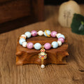 Gray ceramic bracelet with Lucky Rabbit design and adjustable cord on wrist