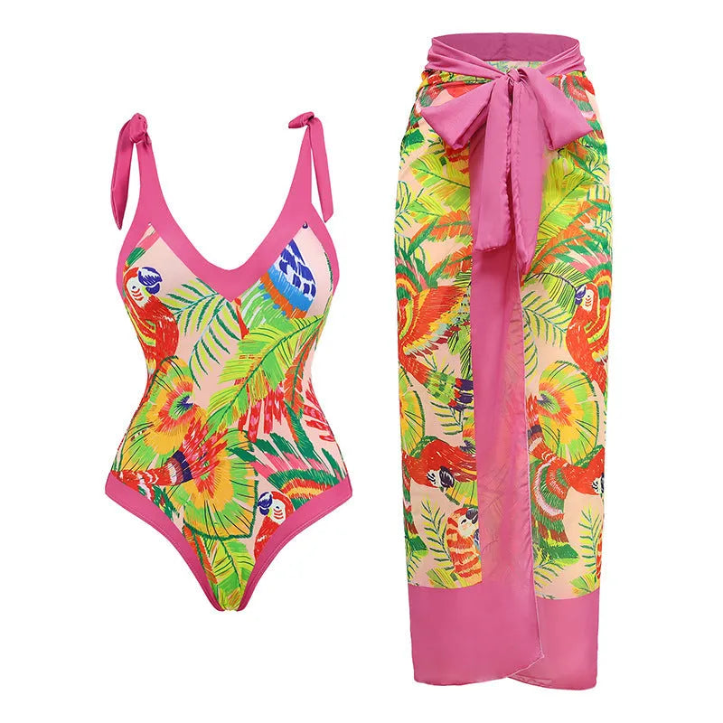 Retro pink floral print one-piece swimsuit with V-neck, thin skirt, and covered belly design.
