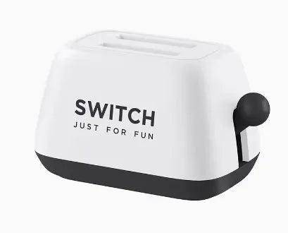 Green Nintendo Switch game card storage box with silicone base on a table