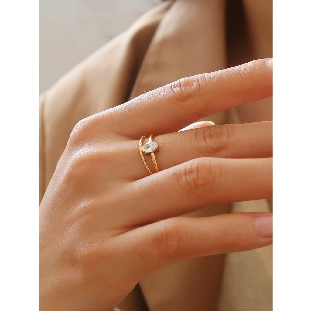 Golden heart-shaped stainless steel ring with electroplated finish available in two colour variations