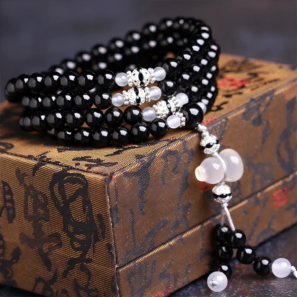 Black agate 108 beads bracelet with geometric shapes and numeric markers on unisex wrist
