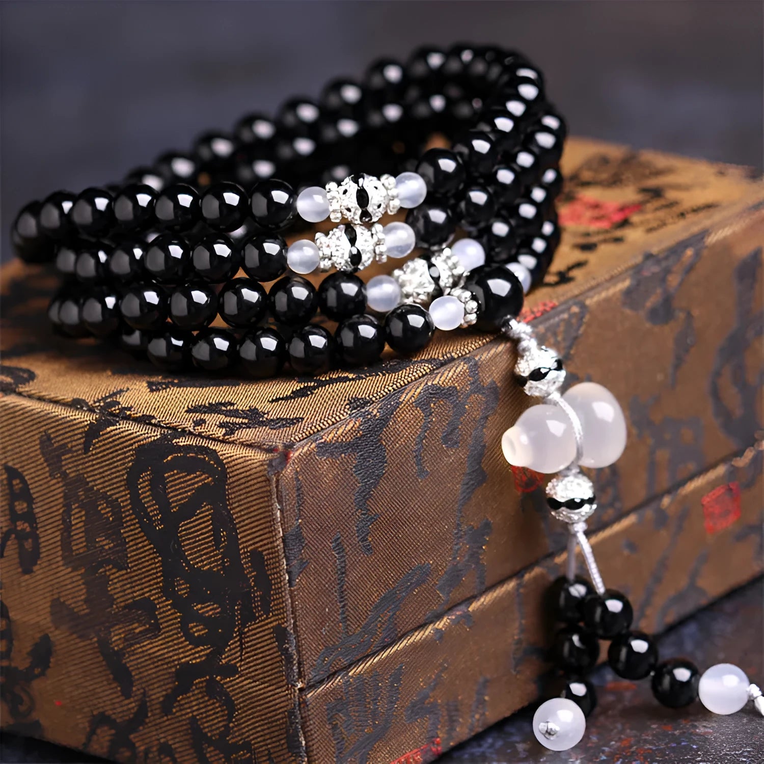 Black agate 108 beads bracelet with geometric shapes and numeric markers on unisex wrist