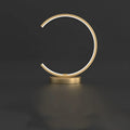 All copper Nordic style table lamp with tri-tone LED light, push button switch, on a wooden desk