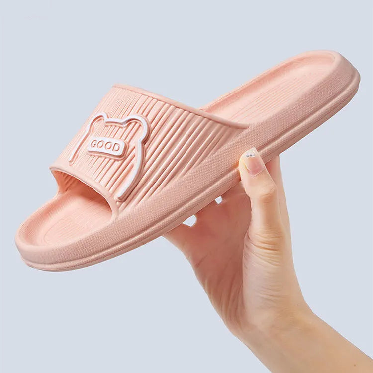 Unisex cartoon bear EVA slippers in light green with open toe and flower detail for bathroom use