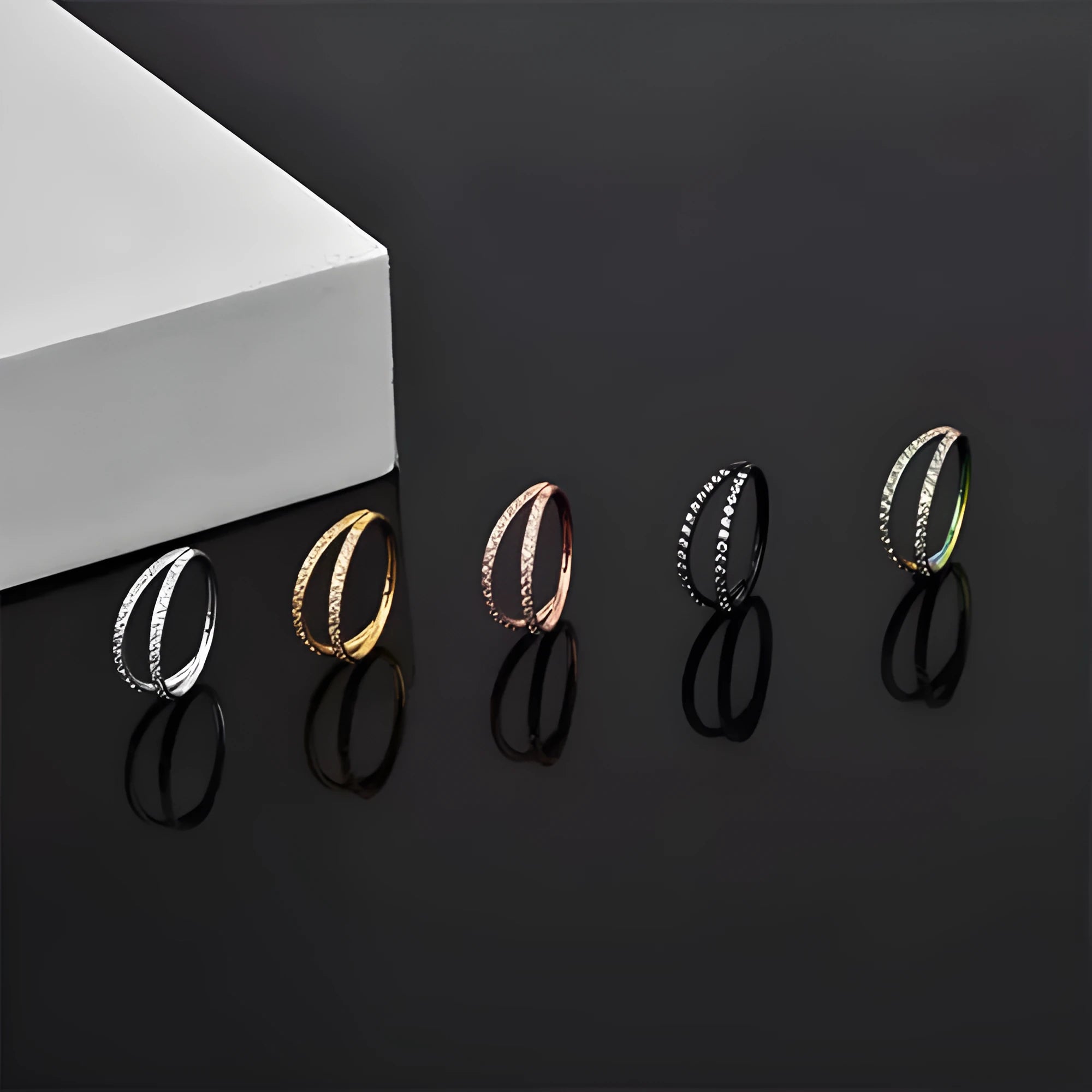 G23 titanium alloy nose ring in gold colour on a white background, showing a circular shape.