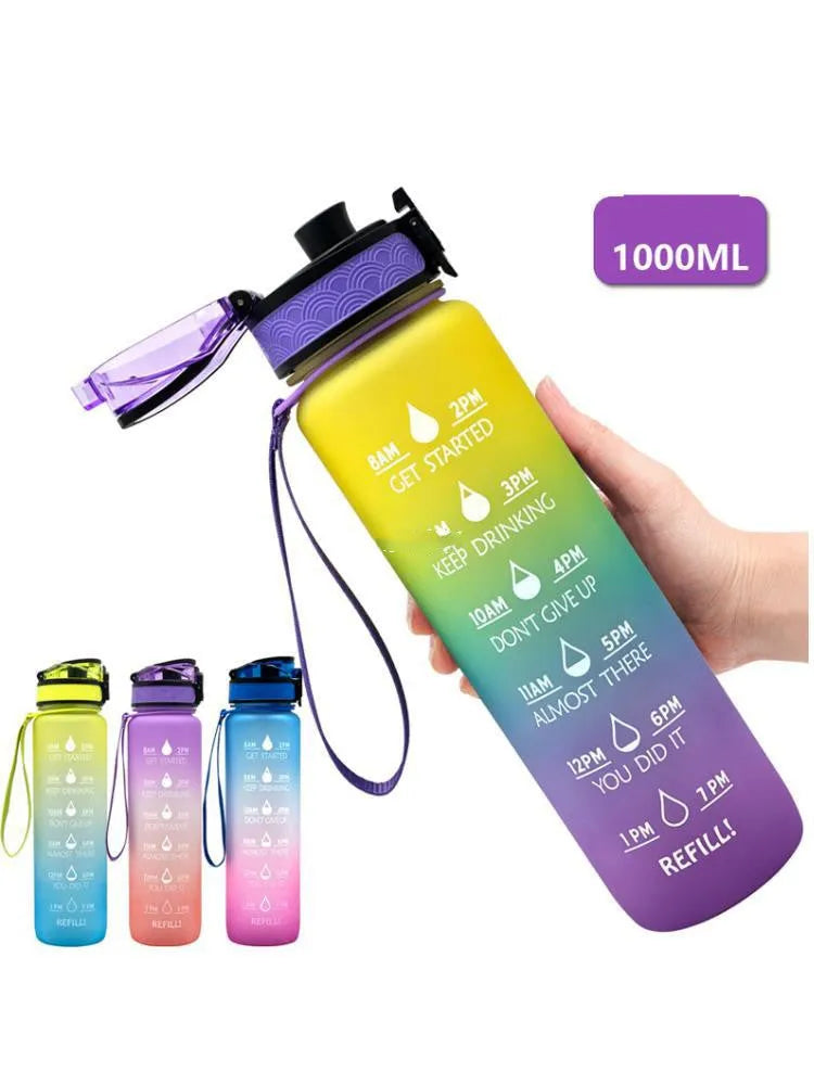 Clear transparent 1000ml sports water bottle with blue lid and removable fruit infuser inside.