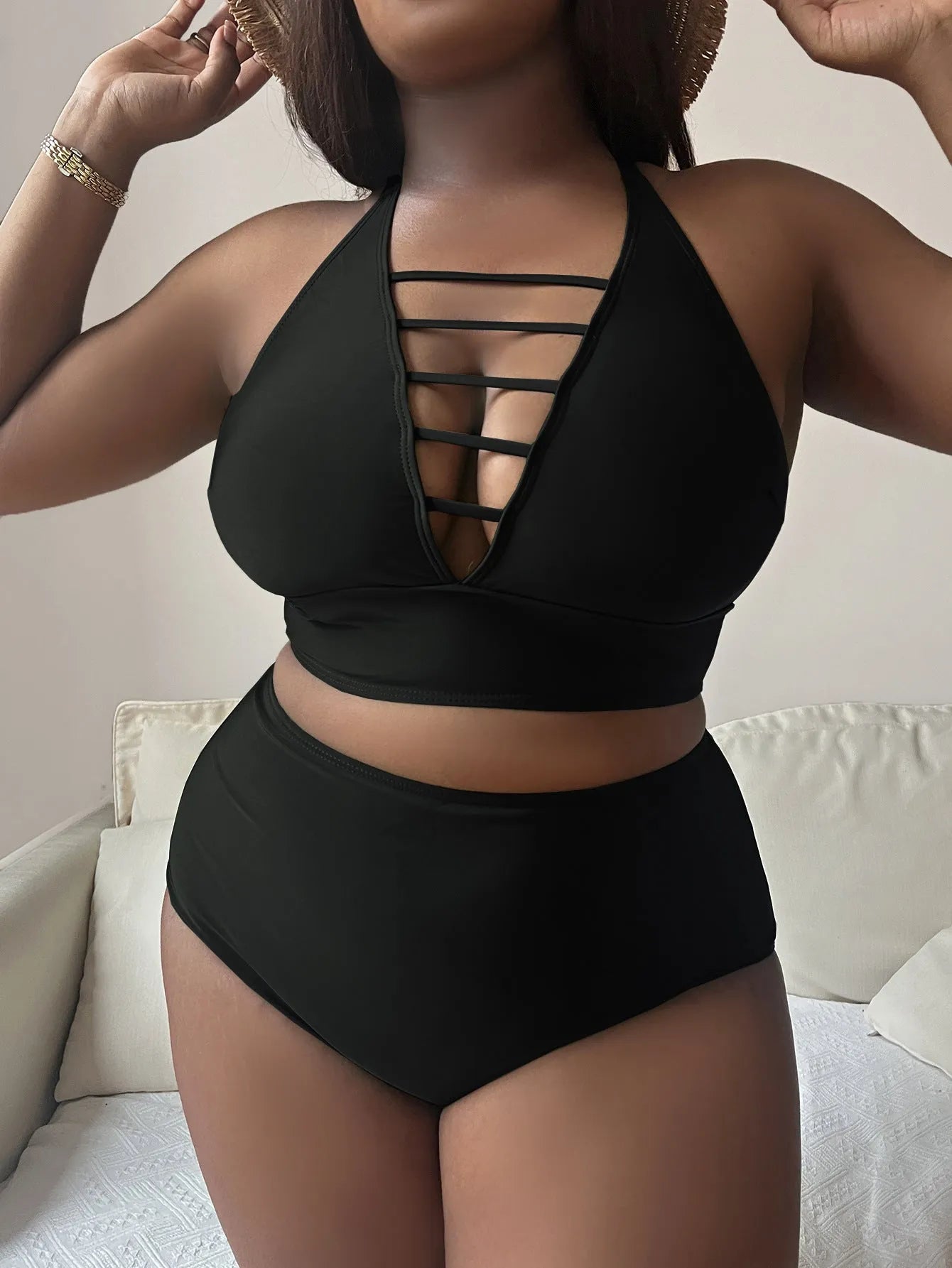 Plus size hollow cross halter bikini in black with adjustable straps and high waist briefs