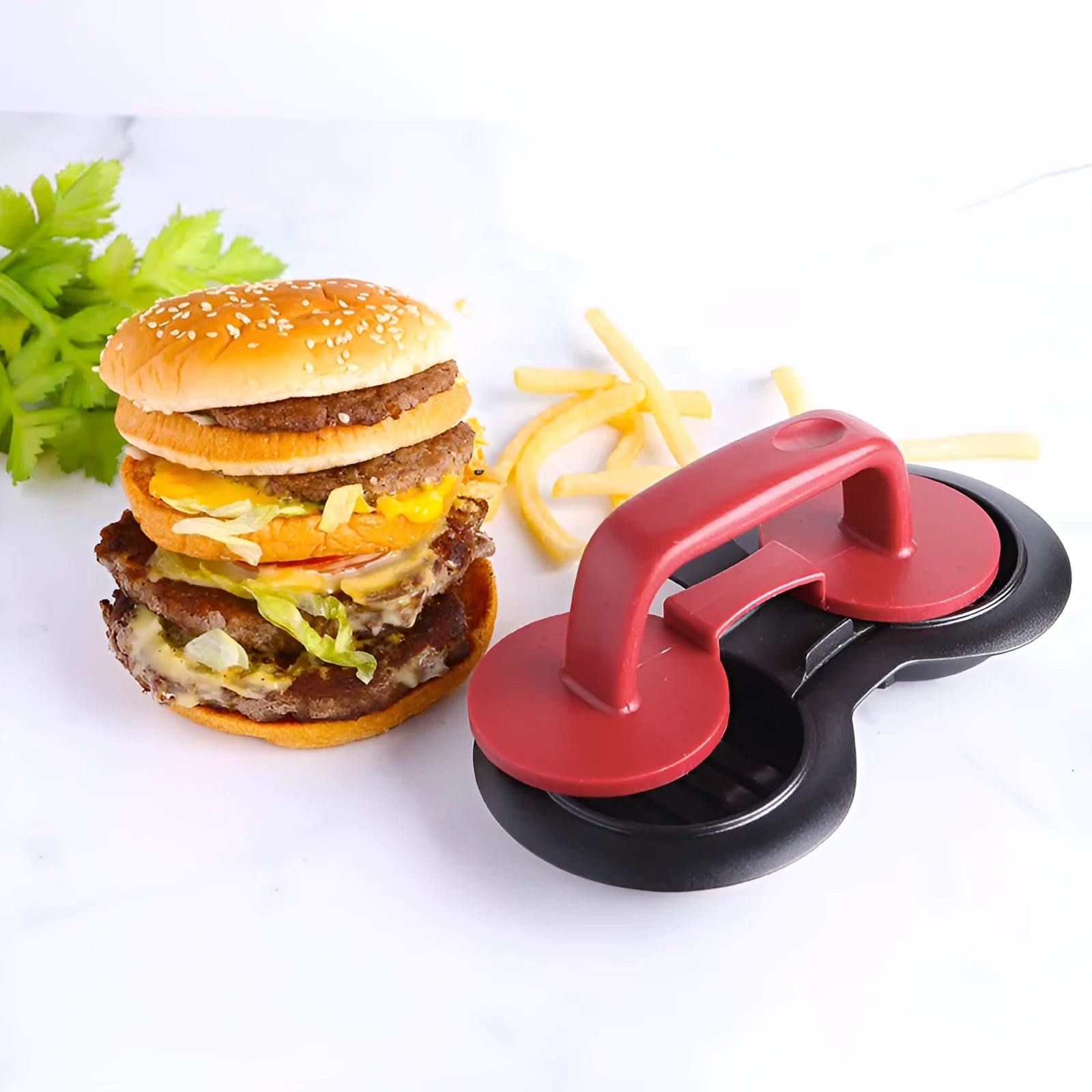 Black and red round plastic burger press for making uniform patties.